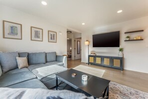 Living Room with Large Sofa Couch and Smart TV