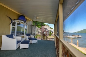 Imagine relaxing on your private patio, where the gentle breeze whispers through the trees and the shimmering waters of the lake stretch as far as the eye can see. This serene outdoor space offers the perfect escape for those who appreciate nature’s