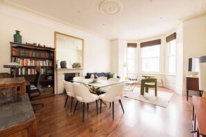 Redcliffe Gardens elegant dining area complemented by a well-lit living space