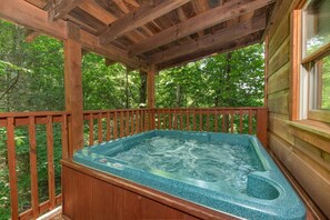 Relax in the hot tub, soaking in the serenity of nature under the stars.