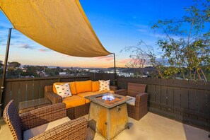 Relax by the fire pit on our scenic terrace, offering breathtaking views—perfect for sunset watching and unwinding.