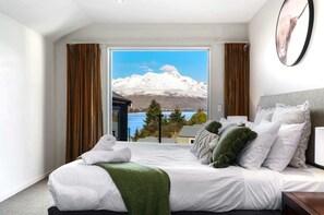 Master Bedroom has gorgeous lake and mountain views.  There is also an ensuite bathroom.