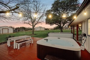 Slip into the warm waters of this hot tub and let the stress of your daily life ease away. Take in the scenic country views under the warm glow of the twinkling string lights.