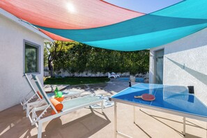 Get some shade while reading a book in the lounge chair