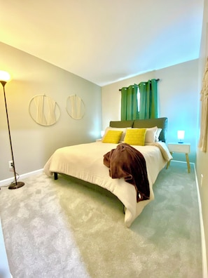 Cozy back bedroom with queen bed.
