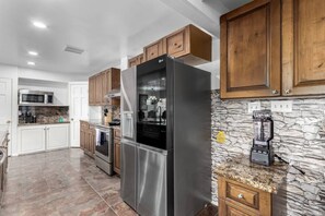 Fully stocked kitchen with modern appliances, cook up anything you crave!