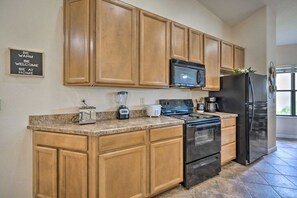 Whip up your favorites in a fully stocked kitchen featuring modern appliances and all the essentials.