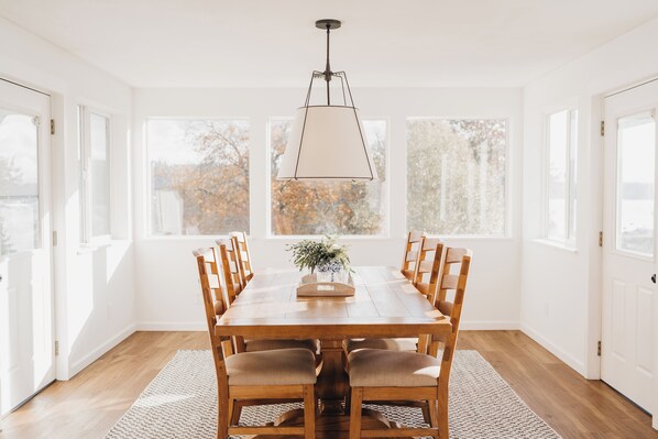 Dining Room surrounded by windows so you can take in the water view.