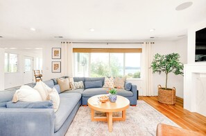 The main living room boasts a beautiful water view with amazing sunrises. 
