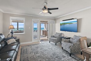 2nd Floor has the Primary Living Space with a comfortable, Gulf View living room with tons of seating around a 55" Smart TV!