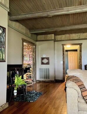 You walked through the front door. Ceilings raised & lined with stained cedar.