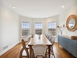 Dine in style with breathtaking scenic views from this luxurious waterfront dining area, perfect for entertaining family and friends.
