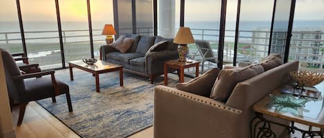 living room with floor to ceiling windows