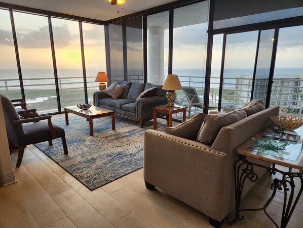 living room with floor to ceiling windows