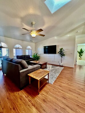 Experience true relaxation in the inviting living room, bathed in natural light