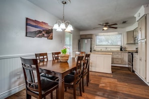 Warm, open layout connects the living and dining rooms—ideal for gathering, playing games, sharing meals, and making lasting memories together.