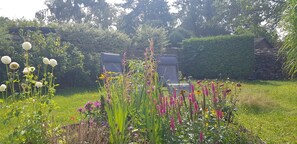 The house is surrounded by a nice garden including outdoor furniture to relax.