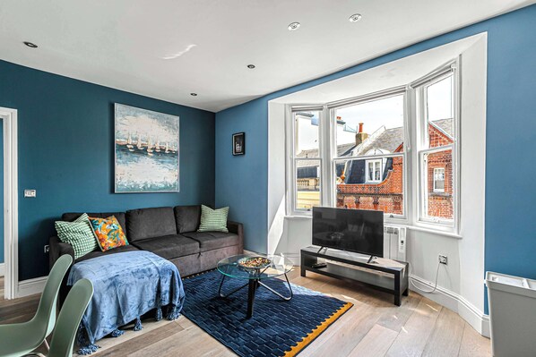 Bright lounge with bay window and cozy seating

