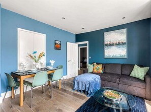 Contemporary lounge with bold accents and art