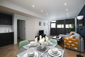 Dining table set for four, open living view