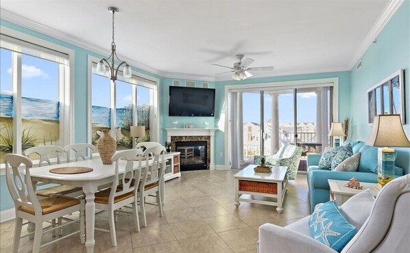 Living area with pull out sofa and electric fireplace. 