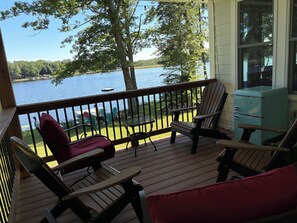 Covered Trex Porch with Seating, mini fridge, string lights and views of lake 