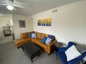 Take a load off on this stylish vegan-leather couch or on one the cozy blue accent chairs. Pillows and throw blankets are at the ready to maximize your comfort.