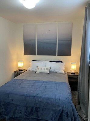 Another one of our bedrooms. In addition to cozy bedding, each bedroom has storage for your belongings. 