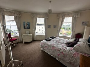 Double bed and adjacent to the shower room and other double bedroom. Sea views