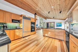 Kitchen: Sub-Zero fridge, Viking range, drip coffee maker, blender, toaster, cooking utensils, tableware