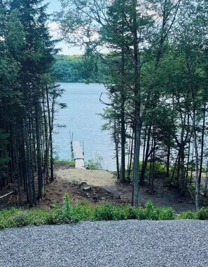 View down to lake & beach/dock area from the house porch