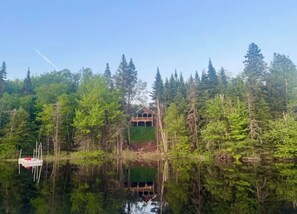 View of house from the lake. This photo was in the spring, water level is high