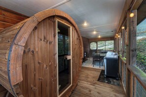 Experience ultimate relaxation in our sauna on the deck, surrounded by the beauty of the outdoors.