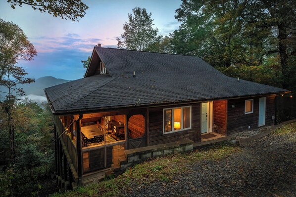 Experience the peaceful transition from day to night with sweeping twilight views of the mountains from our cabin retreat.