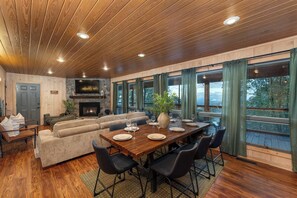 Our open floor plan with large windows invites the beauty of the mountains into every corner of the dining and living room.