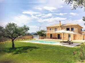Exterior of the property – Front view – Traditional stone and tile villa

