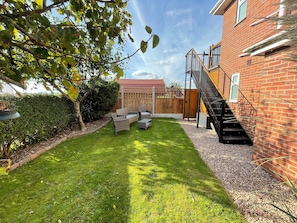 Enclosed private garden with seating