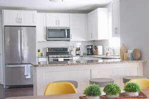 Full kitchen with coffee pot, knifes and more. 