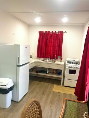 Kitchenette with fridge and stove