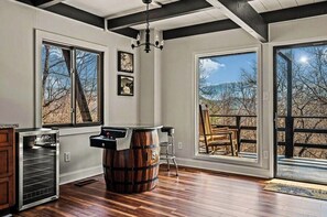 This cabin features a wine cooler and a Pacman arcade game. 