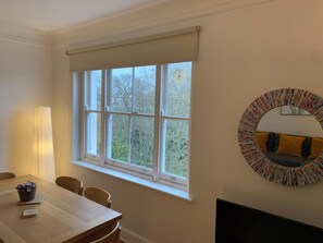 View of the communal garden from the living room in winter