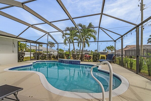 Welcome to your private pool & waterfall. The screened in patio keeps bugs away!