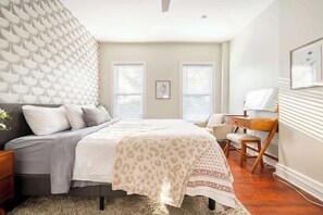 Your huge master bedroom with super comfy king sized bed, dresser, closet, ceiling fan, vanity/desk with mirror and plenty of natural light.