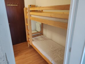 Cosy and functional, this bunk bed setup is perfect for families or groups, offering a comfortable sleeping solution in an inviting space.