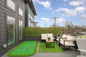 Private rooftop deck with lounge area and putting green. (3rd Floor)