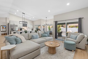 Stylish dining area with views of the kitchen and living room.