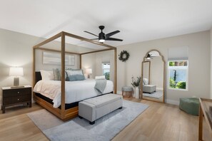 Master bedroom with elegant furnishings and an en-suite bathroom.