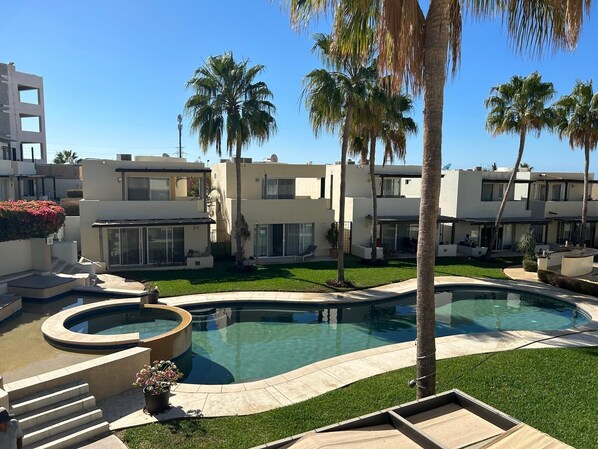 Beautiful community pool just steps away from the villa, perfect for relaxing and enjoying the sun.