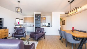 Relax in the stylish living room at SkyView Penthouse by LovelyStay, featuring modern furnishings. #modern #apartment #penthouse #funchal