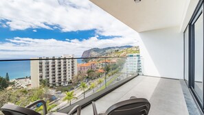 Step out onto the balcony of SkyView Penthouse by LovelyStay, where you can enjoy breathtaking views of the city, ocean, and mountains, creating the perfect spot to unwind and relax. #balcony
